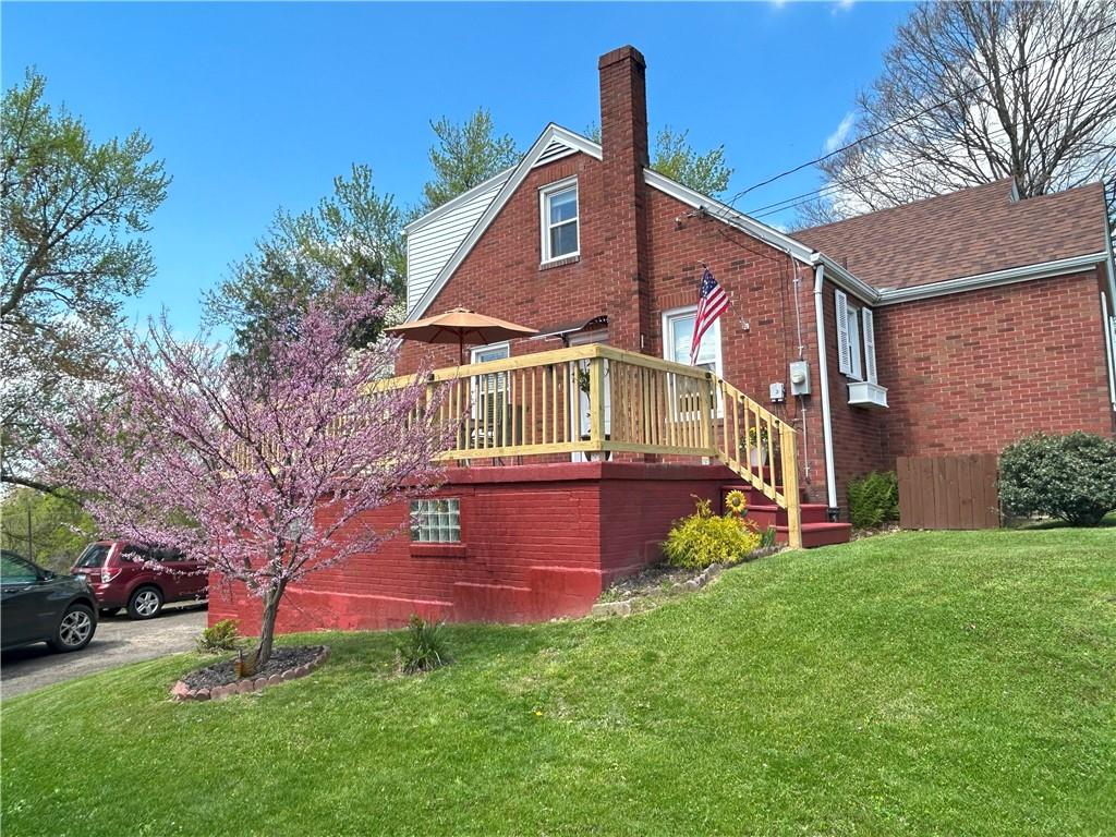1920 Ridge Rd Extension Ambridge, PA 15003 - Photo 5 of 40 a front view of a house with garden