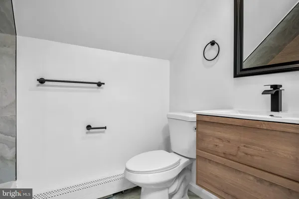 a bathroom with a toilet and a sink