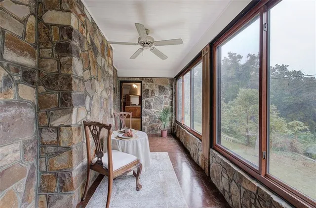 a spacious bedroom with a large bed and a large window