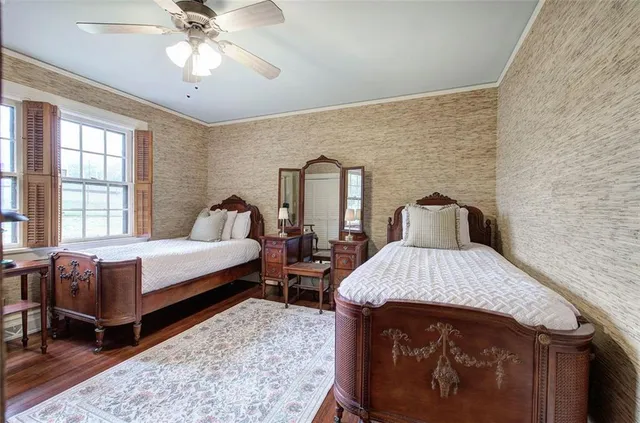 a view of a room with furniture wooden floor and window