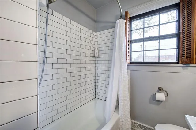a view of a livingroom with furniture and a bookshelf