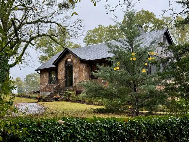 a house with trees in the background