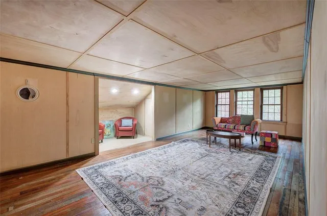a view of a house with backyard sitting area and garden