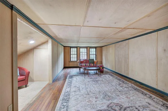 a view of a house with a yard balcony and sitting area