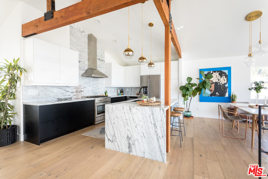 1320 Romulus Drive Glendale, CA 91205 - Photo 15 of 54 a living room with stainless steel appliances kitchen island granite countertop a sink a stove and a wooden floors