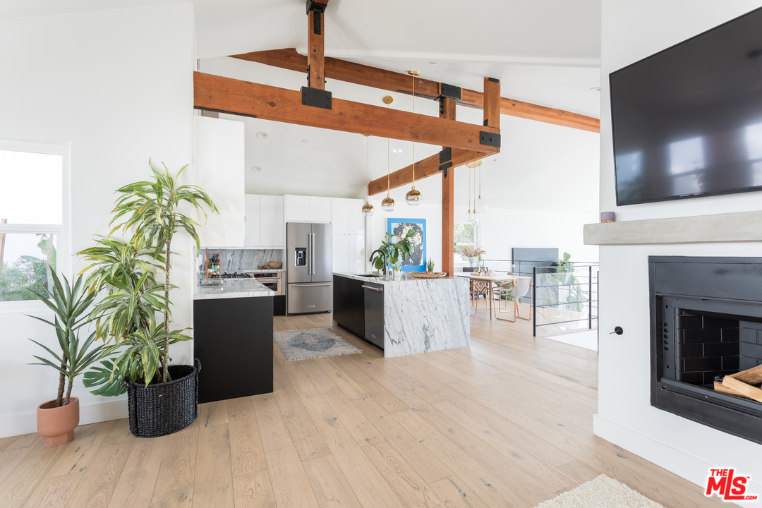 1320 Romulus Drive Glendale, CA 91205 - Photo 17 of 54 a living room with furniture a flat screen tv and a fireplace