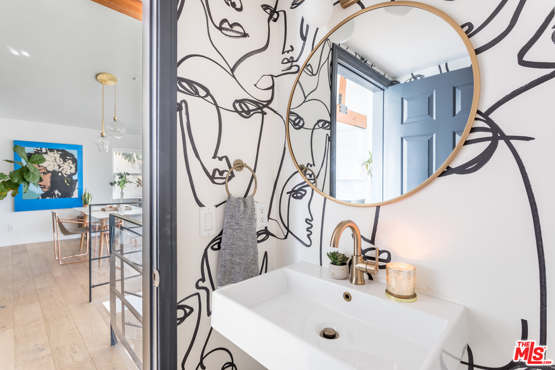 1320 Romulus Drive Glendale, CA 91205 - Photo 30 of 54 a bathroom with a sink and a mirror