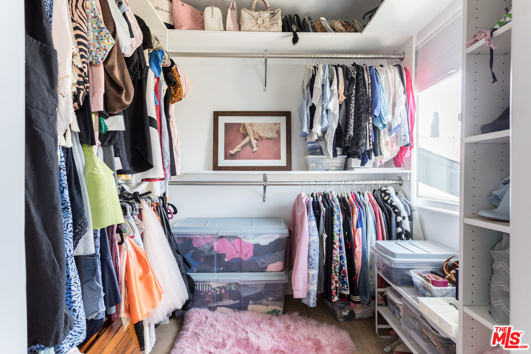 1320 Romulus Drive Glendale, CA 91205 - Photo 36 of 54 a view of walk in closet with clothes and shoes