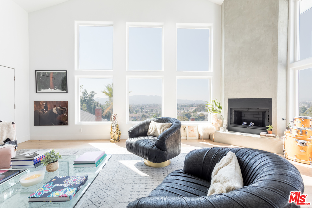 1320 Romulus Drive Glendale, CA 91205 - Photo 5 of 54 a living room with furniture large window and a fireplace