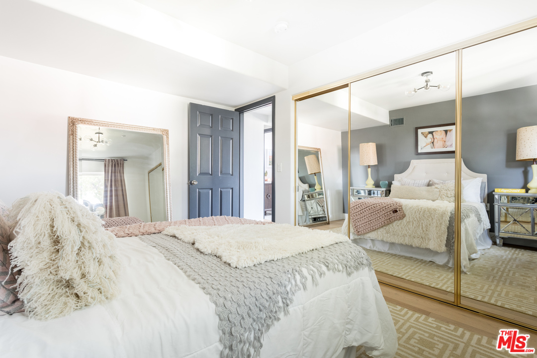 1320 Romulus Drive Glendale, CA 91205 - Photo 49 of 54 a bedroom with a bed and a large mirror