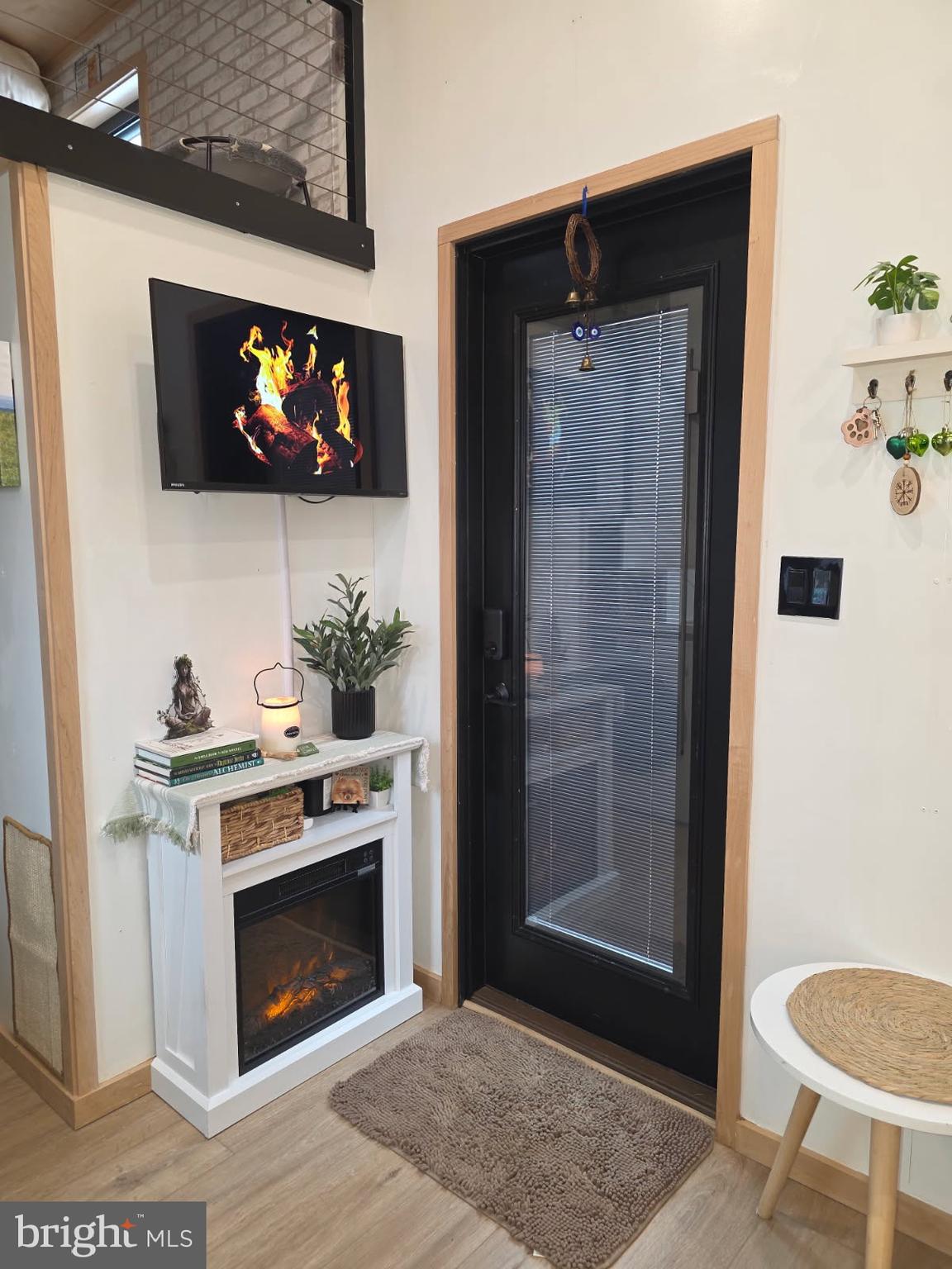 867 Schwanger Road Elizabethtown, PA 17022 - Photo 10 of 14 a living room with a fireplace and a flat screen tv