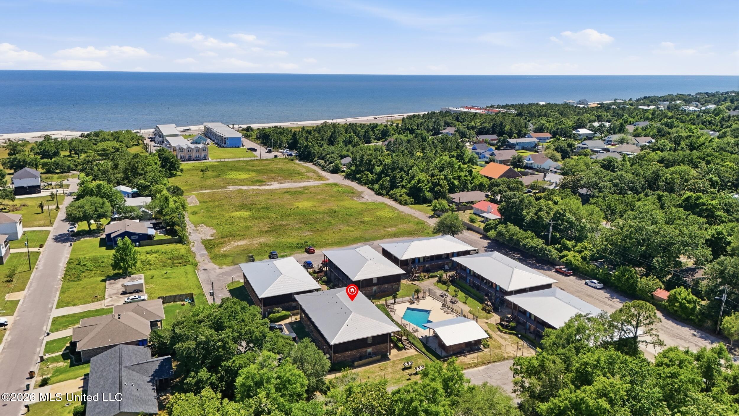 1550 East 2nd Street, Unit R105 Pass Christian, MS 39571 - Photo 32 of 36 35_dji_20260504145032_0056_d_stamped_4f8