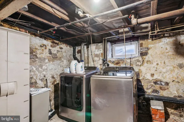 a storage room with stainless steel appliances