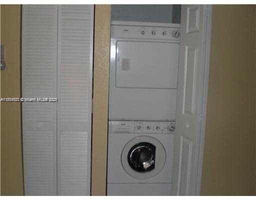 4802 Washington Street, Unit 14 Hollywood, FL 33021 - Photo 11 of 14 a utility room with dryer and washer