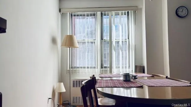a dining room with table and chairs