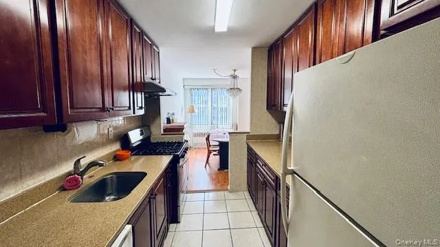 a kitchen with a cabinets and appliances
