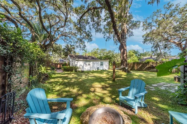 a view of yard with swimming pool
