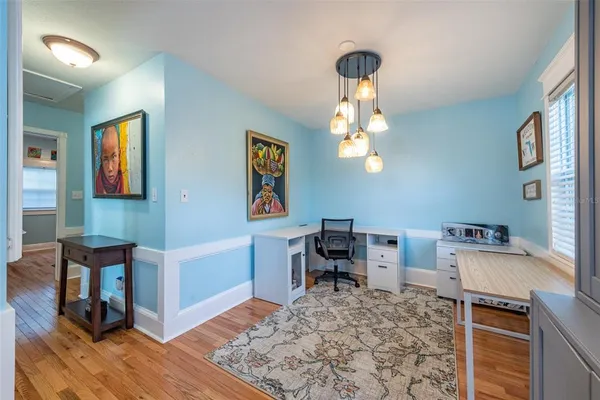 a very nice looking room with a desk and chair