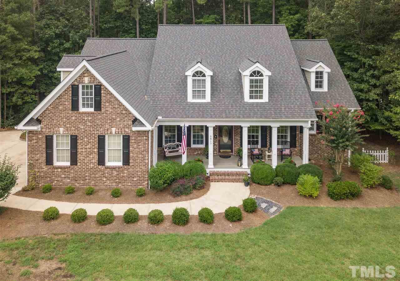 5817 Orchid Valley Road Raleigh, NC 27613 - Photo 1 of 25 a aerial view of a house with yard and green space