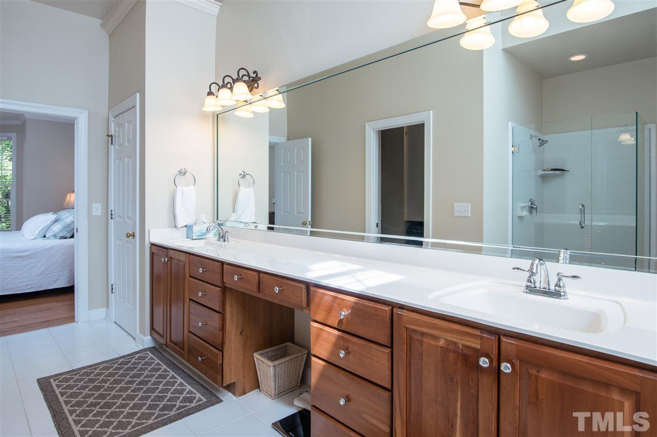 5817 Orchid Valley Road Raleigh, NC 27613 - Photo 15 of 25 a spacious bathroom with a double vanity sink mirror and