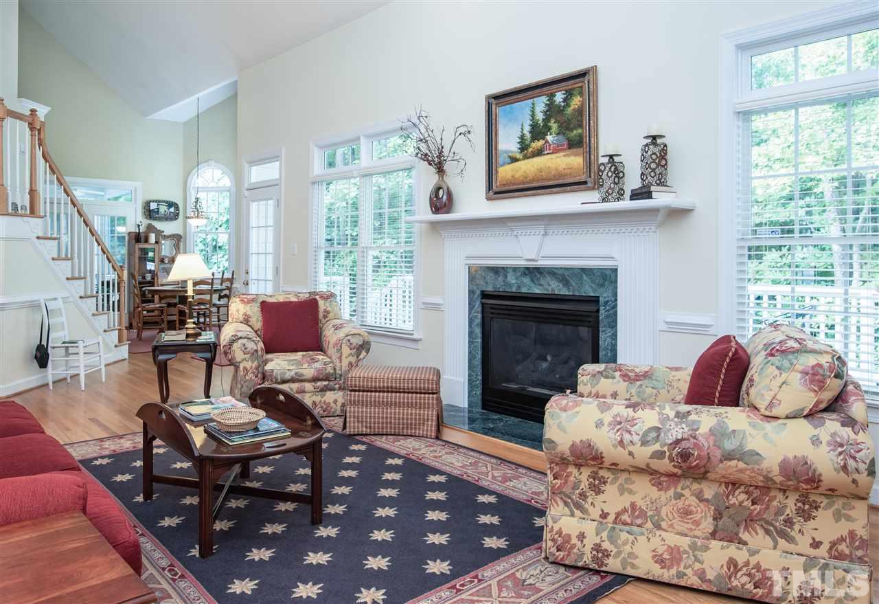 5817 Orchid Valley Road Raleigh, NC 27613 - Photo 3 of 25 a living room with furniture and a fireplace