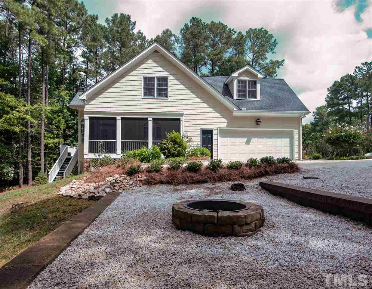 5817 Orchid Valley Road Raleigh, NC 27613 - Photo 23 of 25 a view of a house with backyard and sitting area