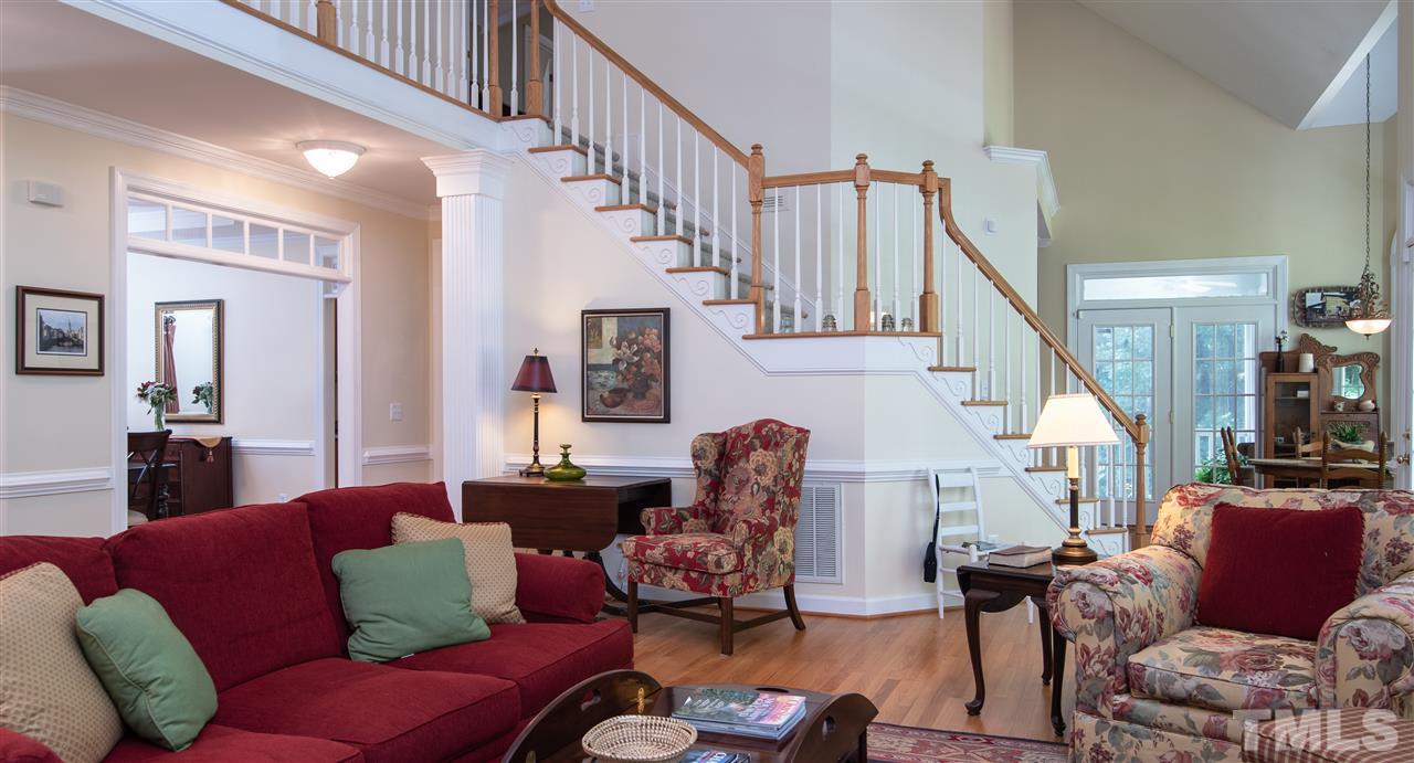 5817 Orchid Valley Road Raleigh, NC 27613 - Photo 4 of 25 a living room with furniture or stairs and a wooden floor