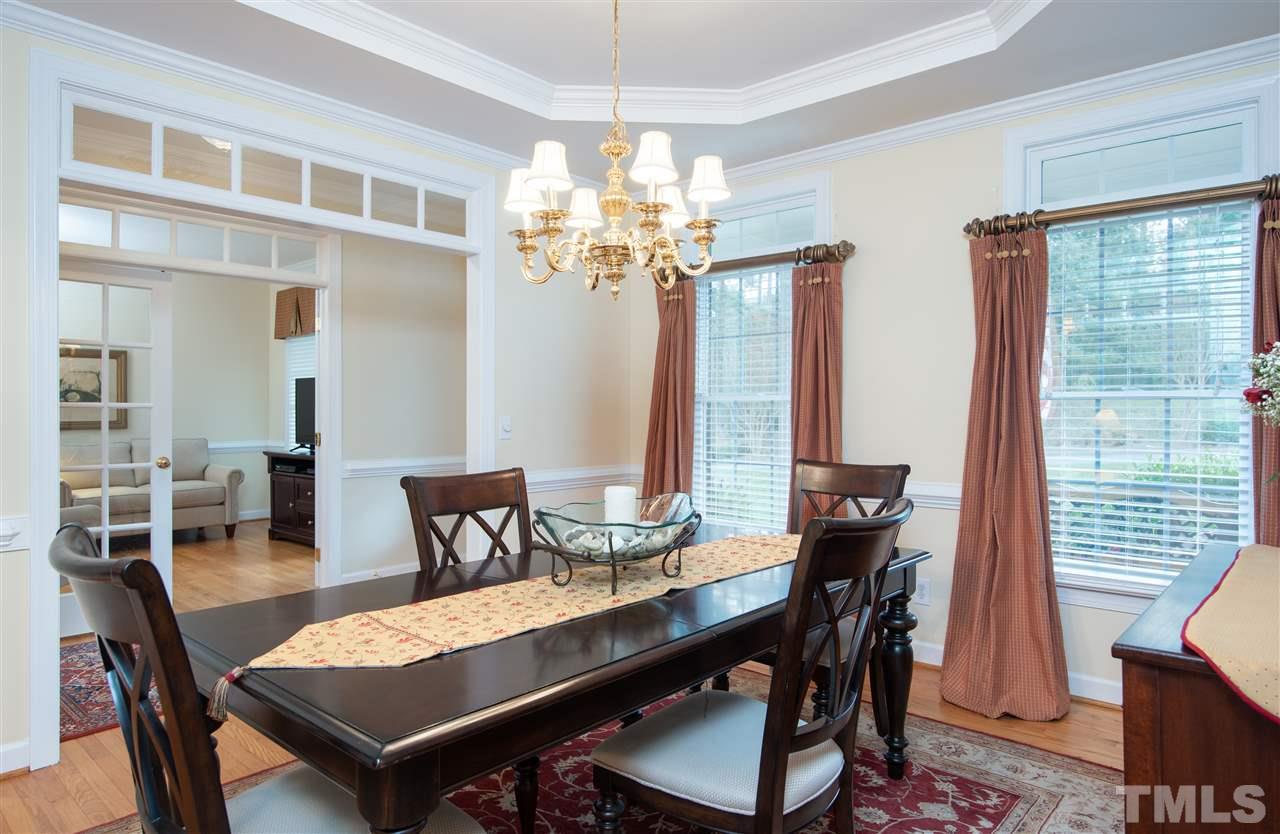 5817 Orchid Valley Road Raleigh, NC 27613 - Photo 5 of 25 a view of a dining room with furniture window and wooden floor