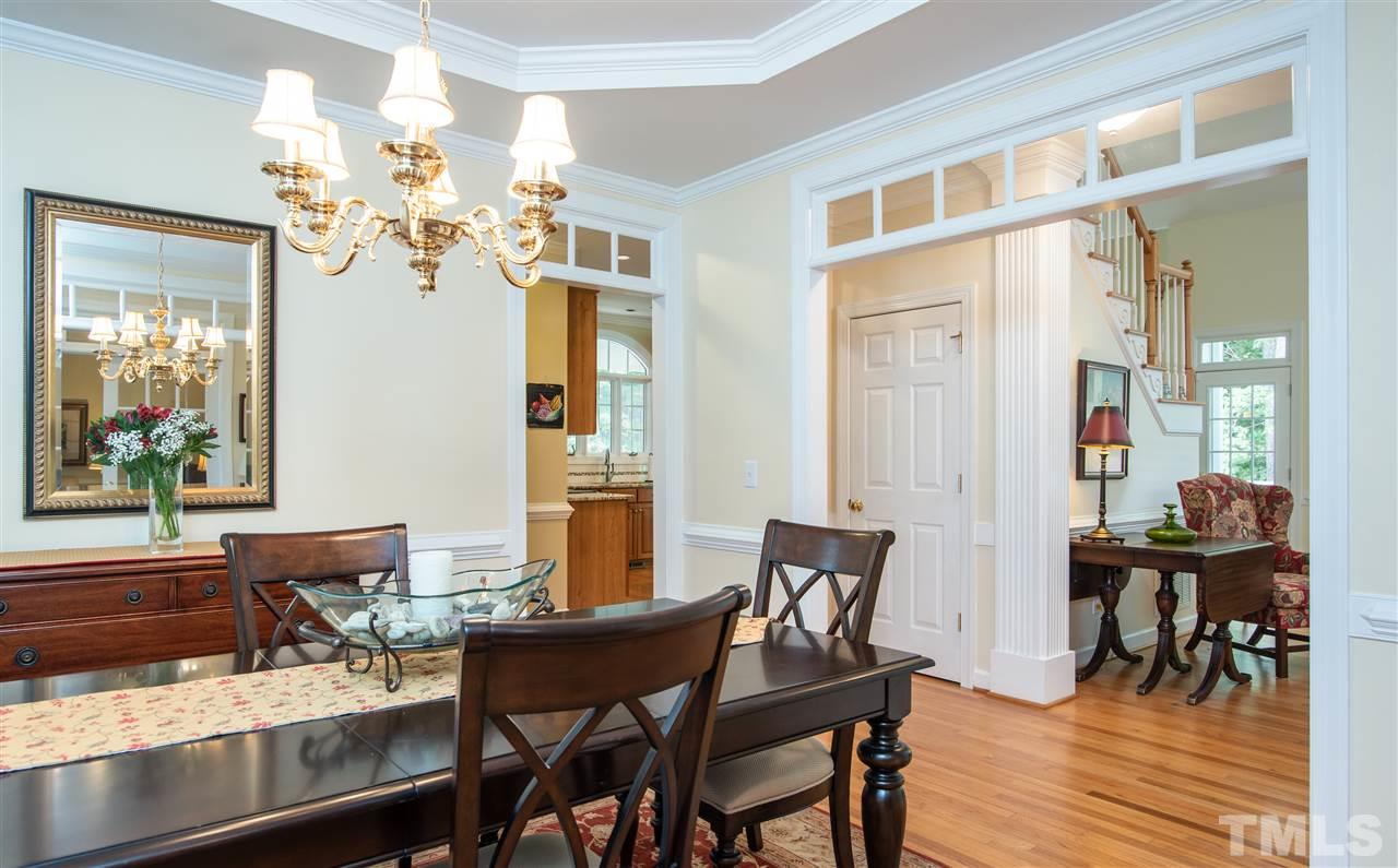 5817 Orchid Valley Road Raleigh, NC 27613 - Photo 6 of 25 a view of a dining room with furniture and chandelier