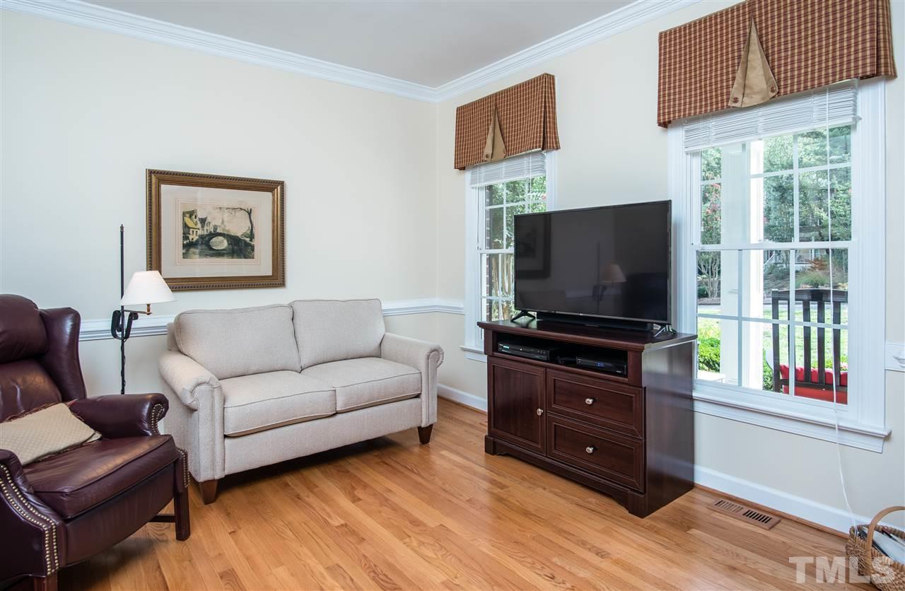 5817 Orchid Valley Road Raleigh, NC 27613 - Photo 7 of 25 a living room with furniture and a flat screen tv