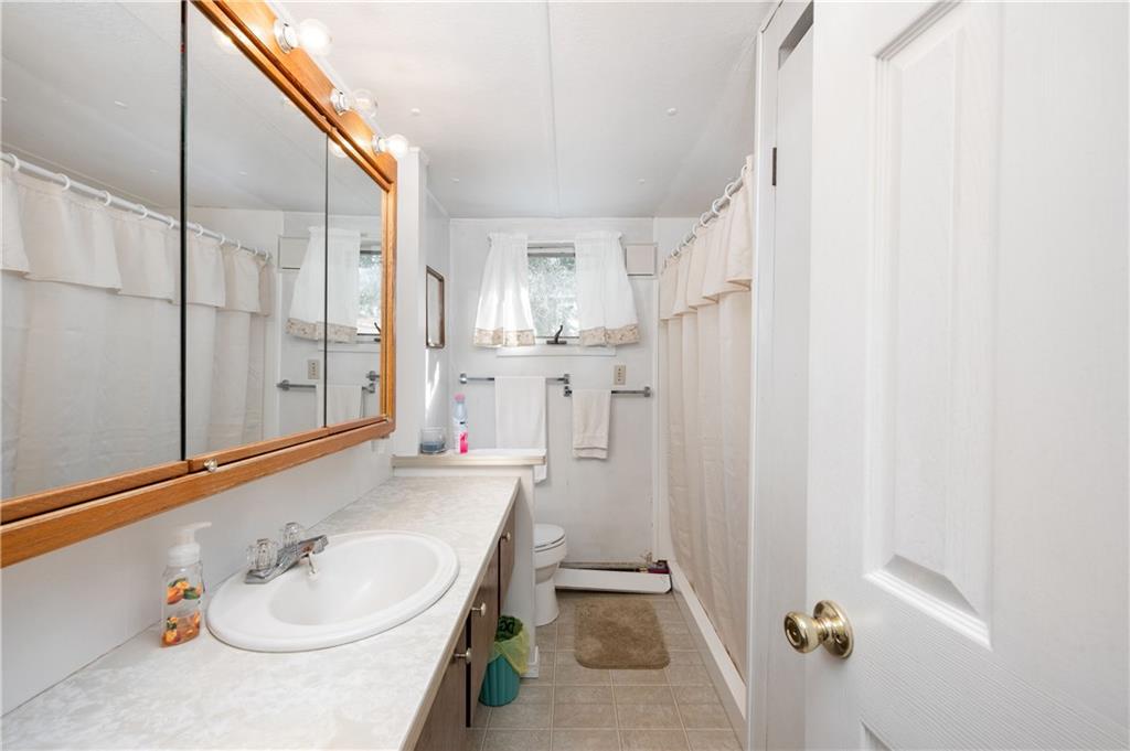 130 Kaiser Road Butler, PA 16002 - Photo 10 of 24 a bathroom with a sink a toilet and shower