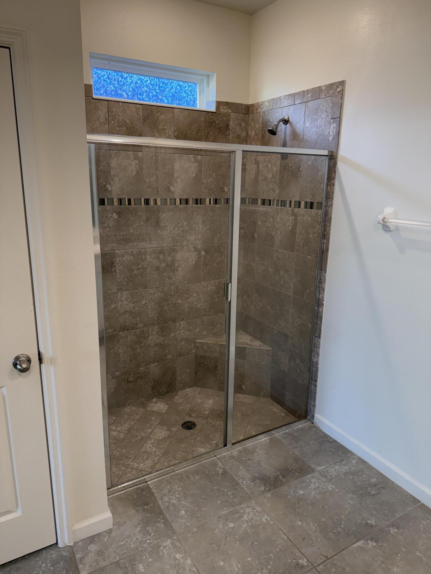 2608 Crowned Eagle Circle Southwest Vero Beach, FL 32962 - Photo 7 of 13 a bathroom with a shower