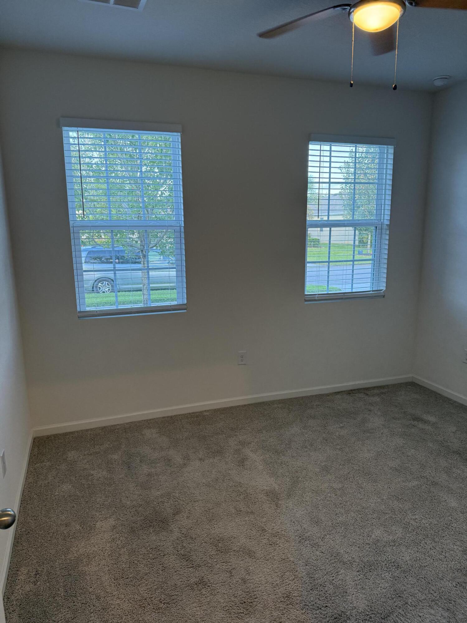 2608 Crowned Eagle Circle Southwest Vero Beach, FL 32962 - Photo 9 of 13 an empty room with a window