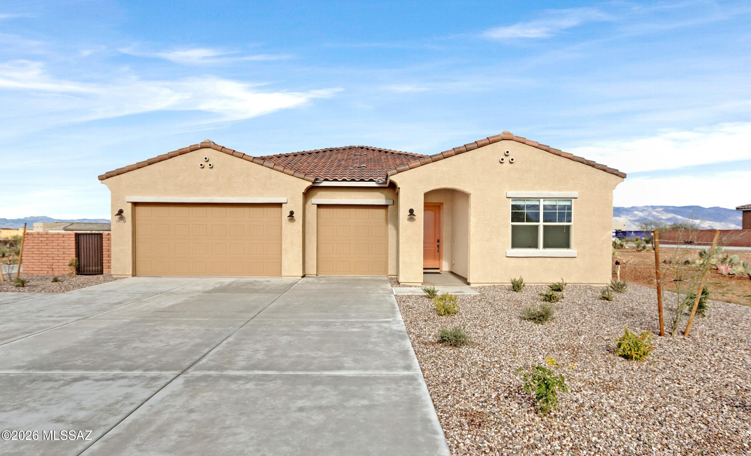 14736 East Sands Ranch Road Vail, AZ 85641 - Photo 18 of 20 a front view of a house with a garden