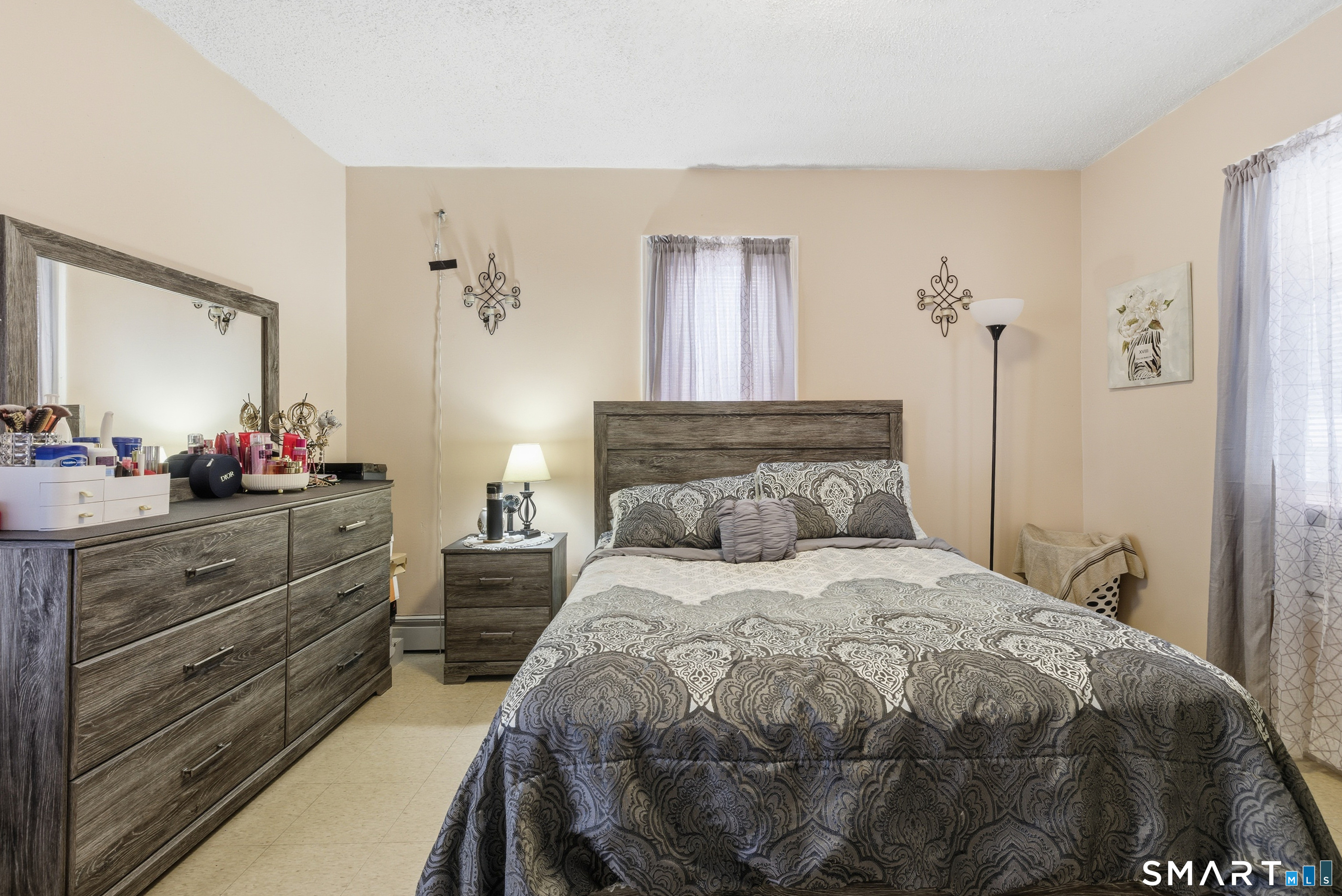 218 Martin Street Hartford, CT 06120 - Photo 12 of 38 a bedroom with a bed and a dresser