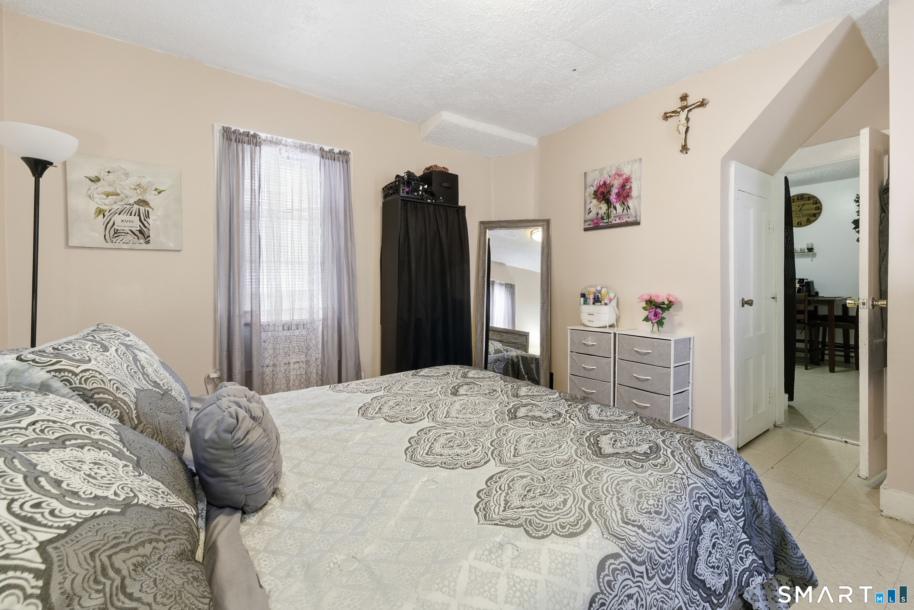 218 Martin Street Hartford, CT 06120 - Photo 13 of 38 a bedroom with a large bed and a dresser