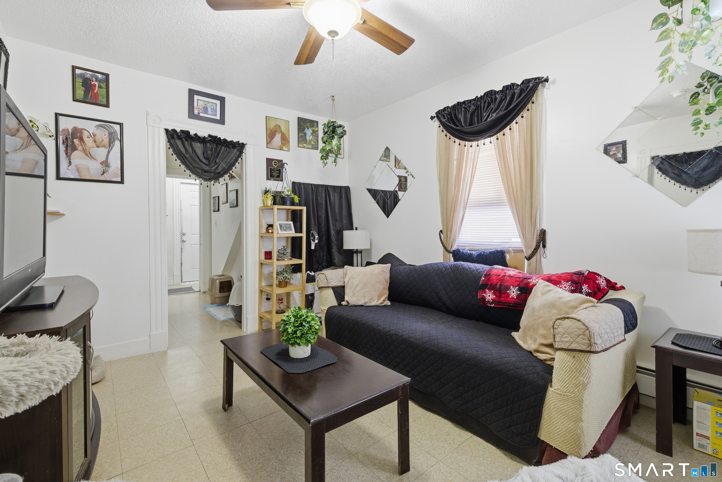 218 Martin Street Hartford, CT 06120 - Photo 18 of 38 a living room with furniture and a wooden floor