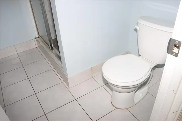 a close view of a toilet and a sink
