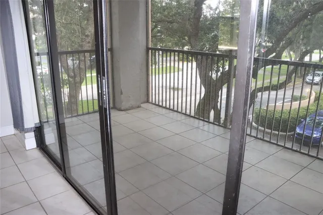 a view of porch with wooden floor