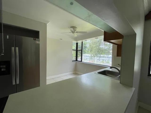 an empty room with windows and outdoor view