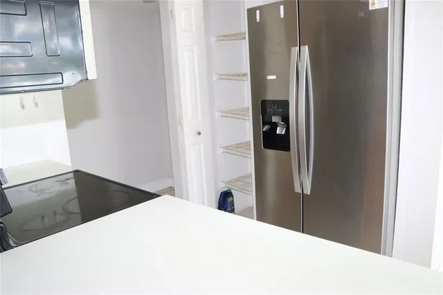 a bedroom with a bed and bathroom