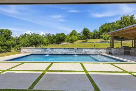 a view of a backyard with sitting area