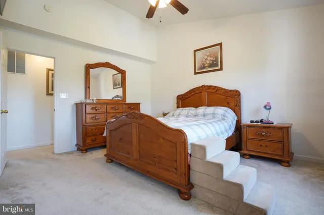 a bedroom with bed and window