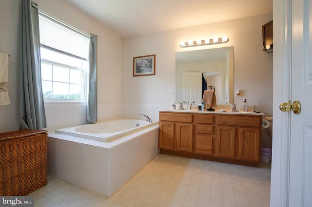 a room with a sink and a mirror