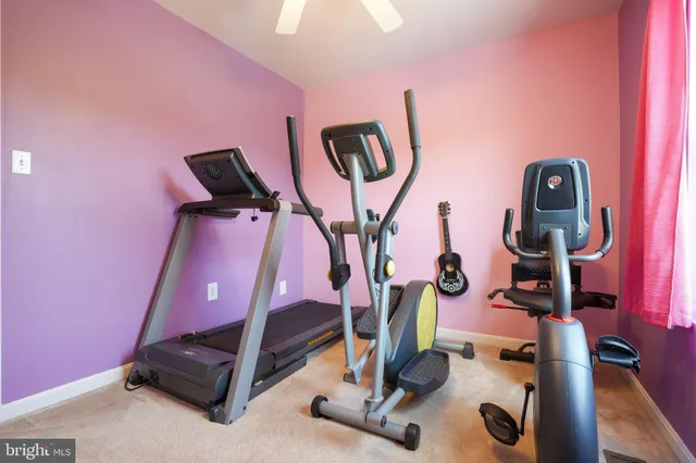 a gym room with gym equipment