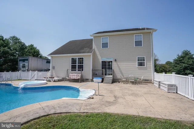 a backyard of a house with seating space