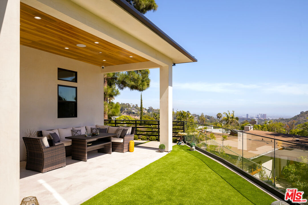 1367 Casiano Road Los Angeles, CA 90049 - Photo 22 of 26 a view of a balcony with chairs
