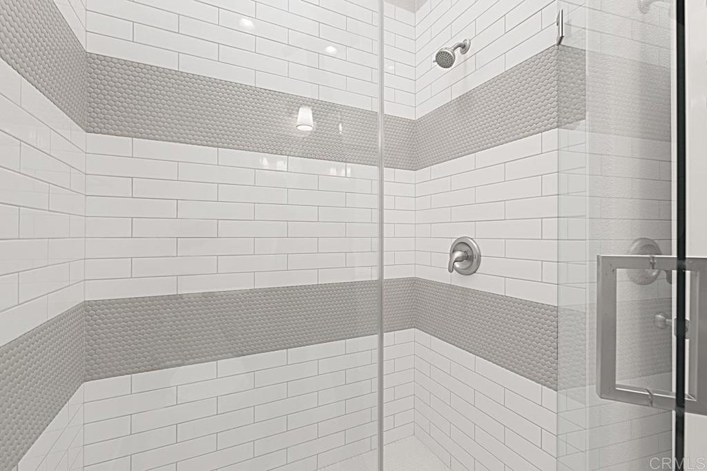 4710 Galicia Way Oceanside, CA 92056 - Photo 18 of 46 a bathroom with a bathtub and shower