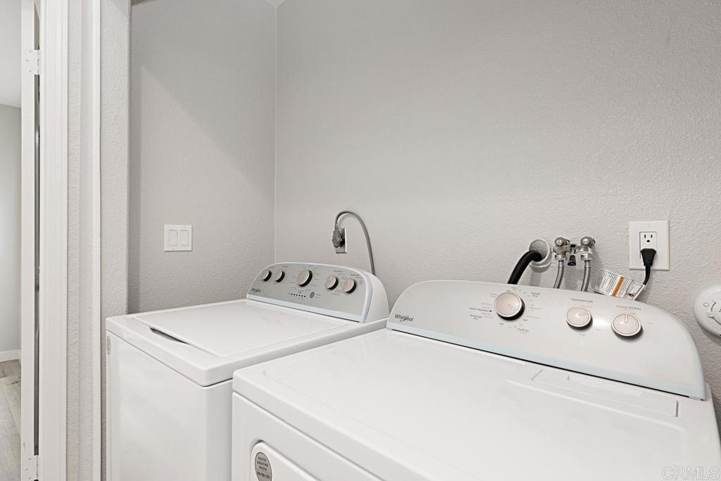 4710 Galicia Way Oceanside, CA 92056 - Photo 22 of 46 a utility room with dryer and washer