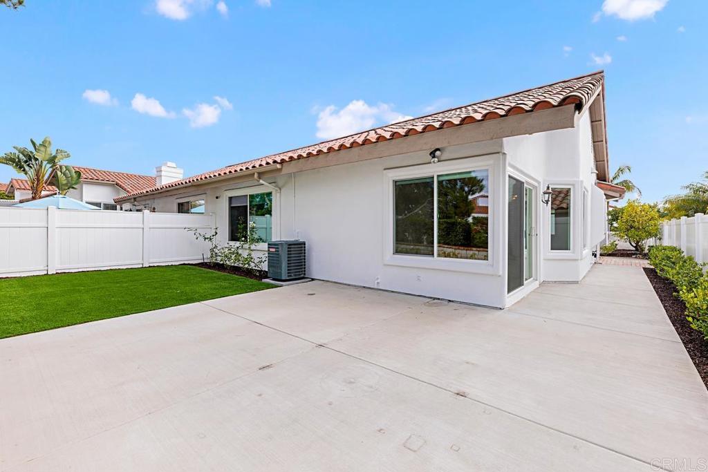 4710 Galicia Way Oceanside, CA 92056 - Photo 25 of 46 a view of house with a yard and potted plants